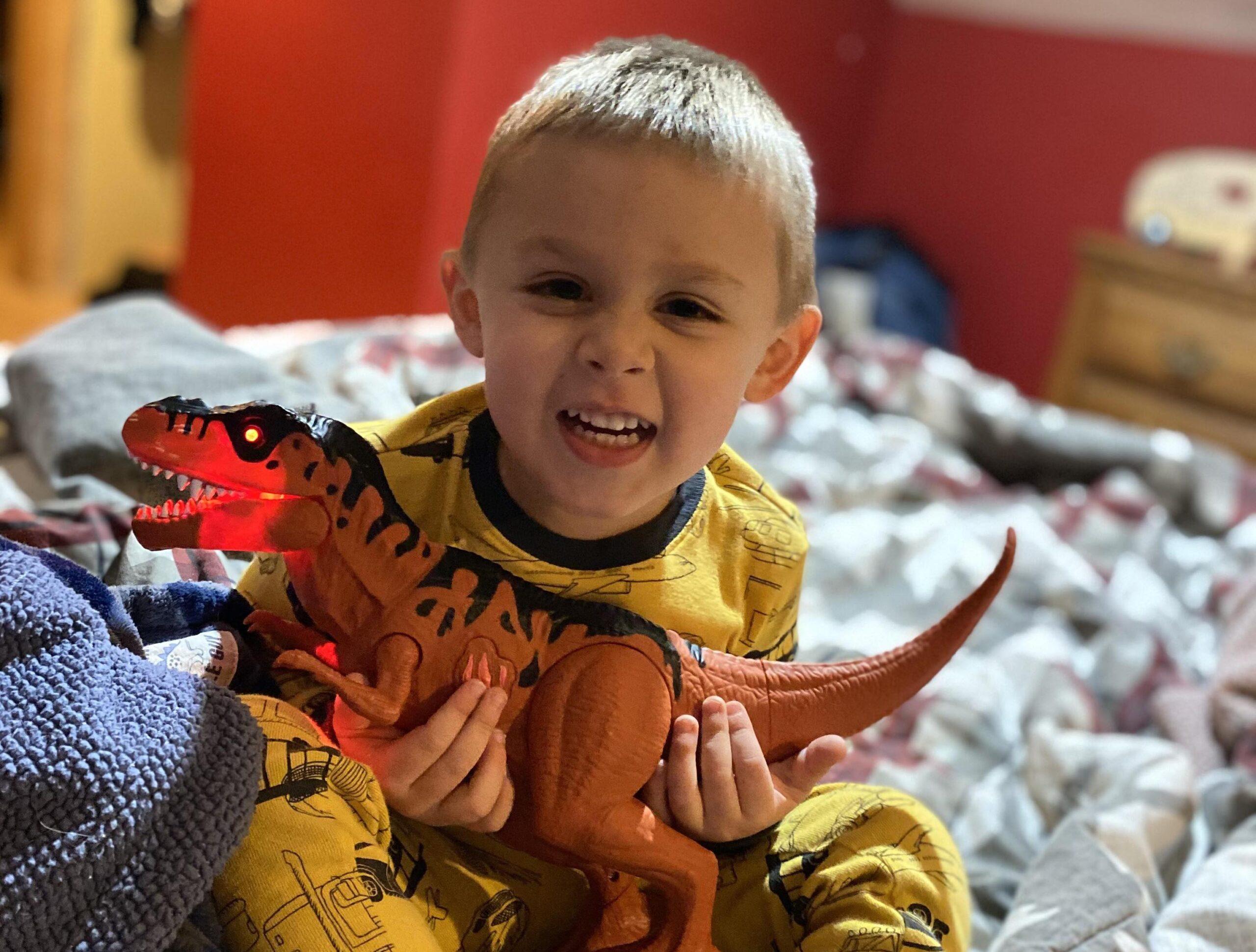 Braxton holding dinosaur